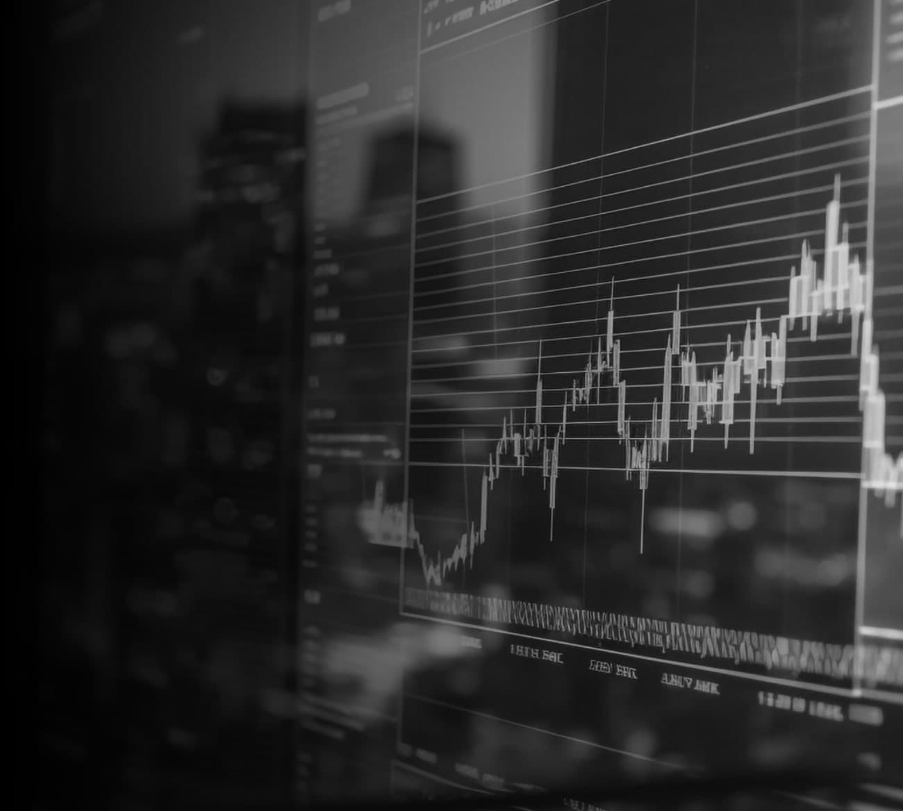 Stock market chart glowing over a city skyline at night