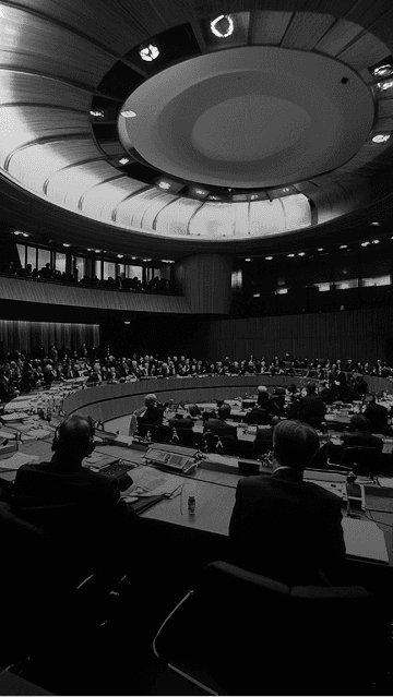 Delegates seated in a conference hall